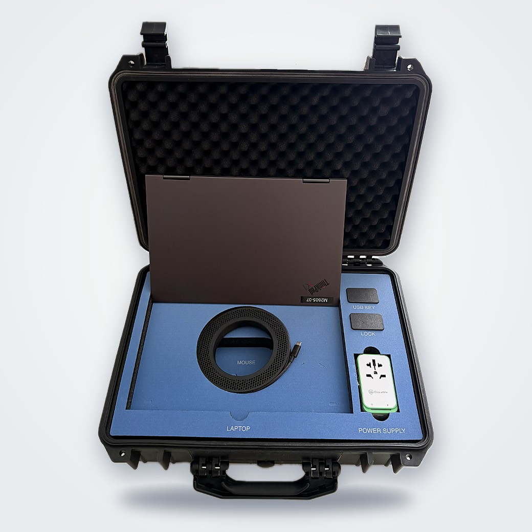 Open Study in a Box case with the study laptop, cable, power supply and compartments for the USB key and lock in a fitted foam insert